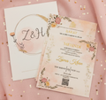 Two wedding invitations on a pink fabric background with floral designs and text.