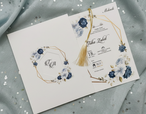 Wedding invitation card with floral design on a textured fabric background