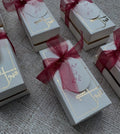 White-and-Gold-Qubool-Hai-Nikkah-Boxes-with-Burgundy-Organza-Ribbons