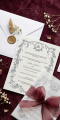 Vellum over the invitation, the envelope with its wax seal and dried florals