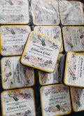Set of coasters with floral designs and text on a white background
